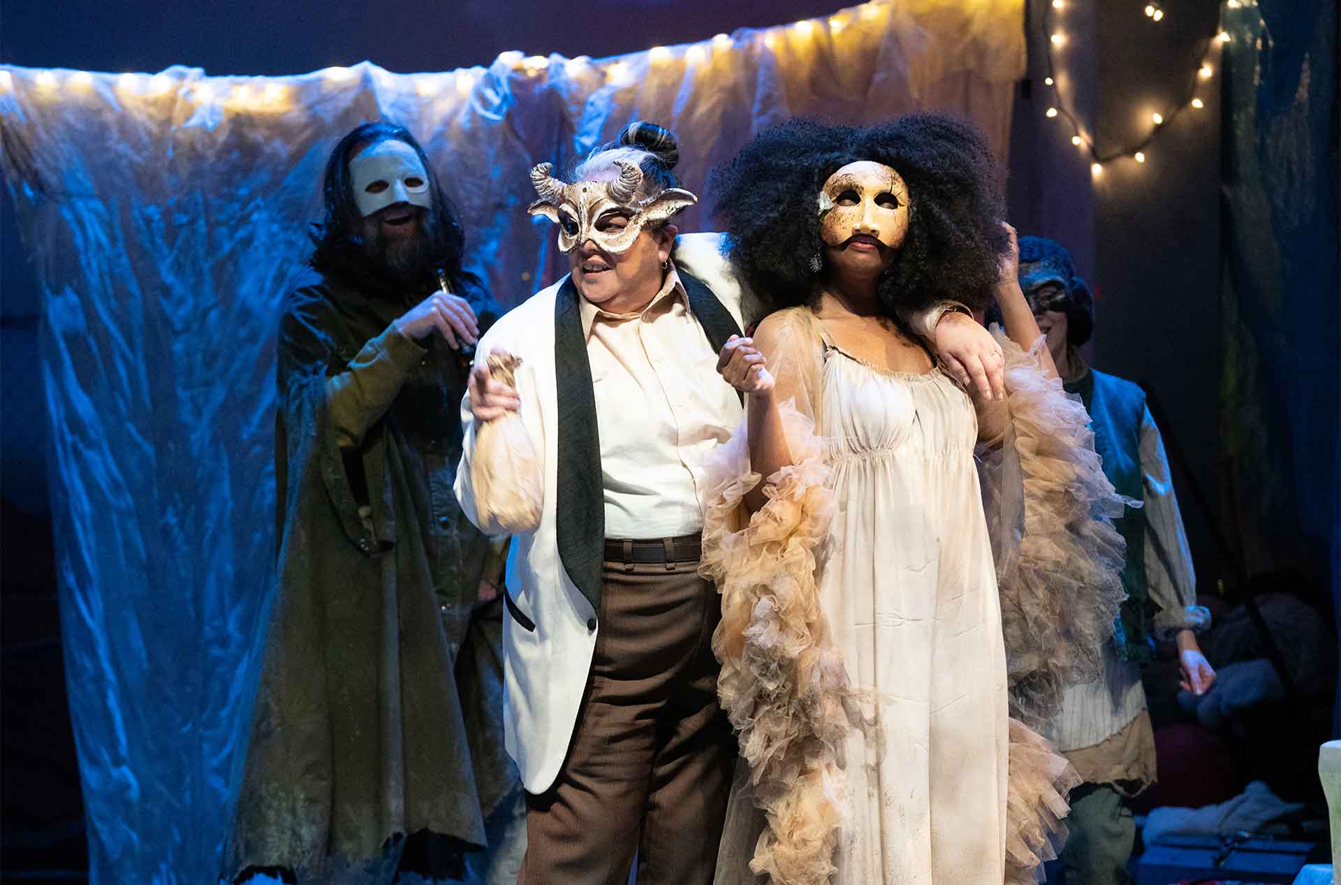 Three people in masquerade masks