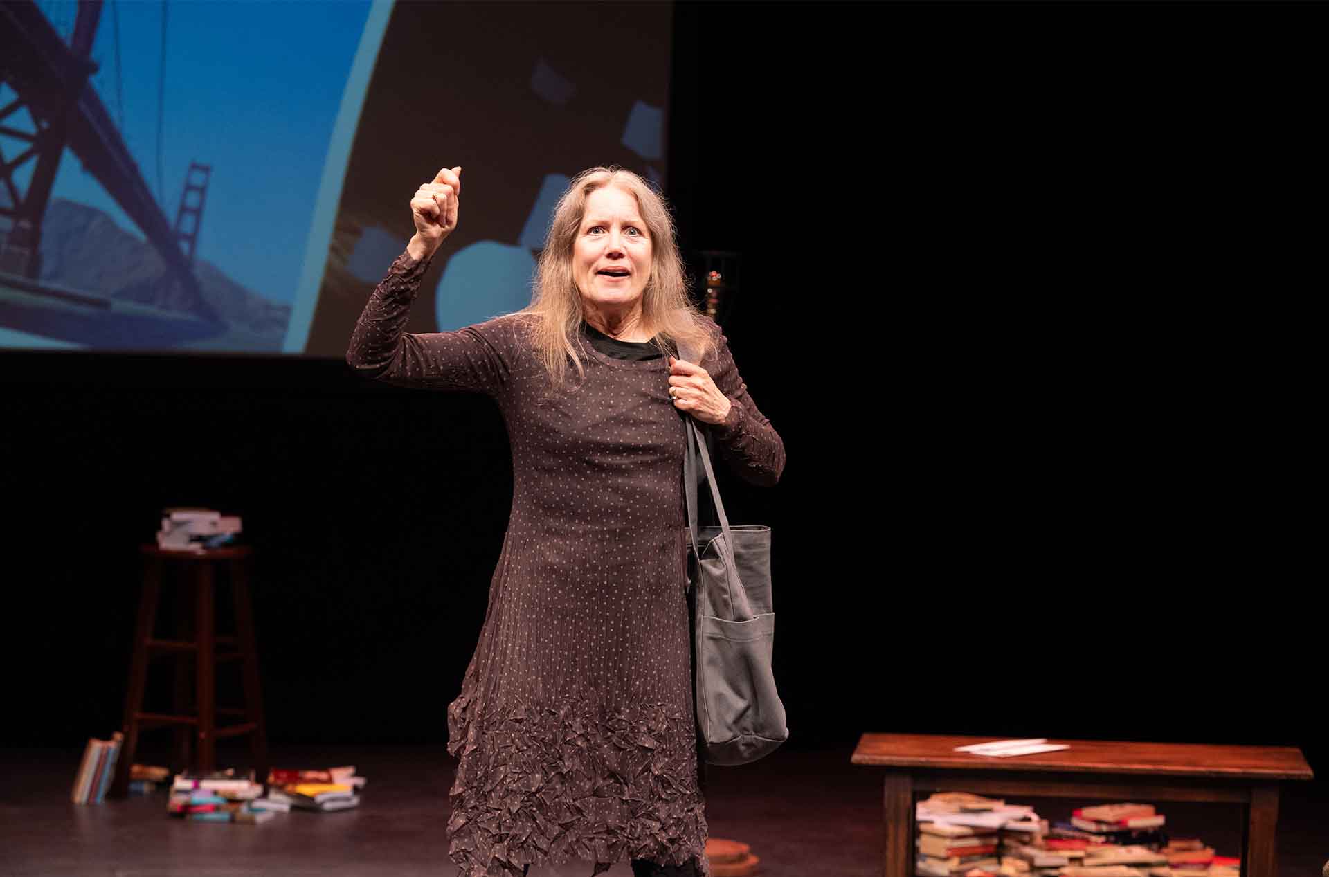 A woman with a bag over her arm.