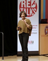 Rosa Joshi lecturing onstage