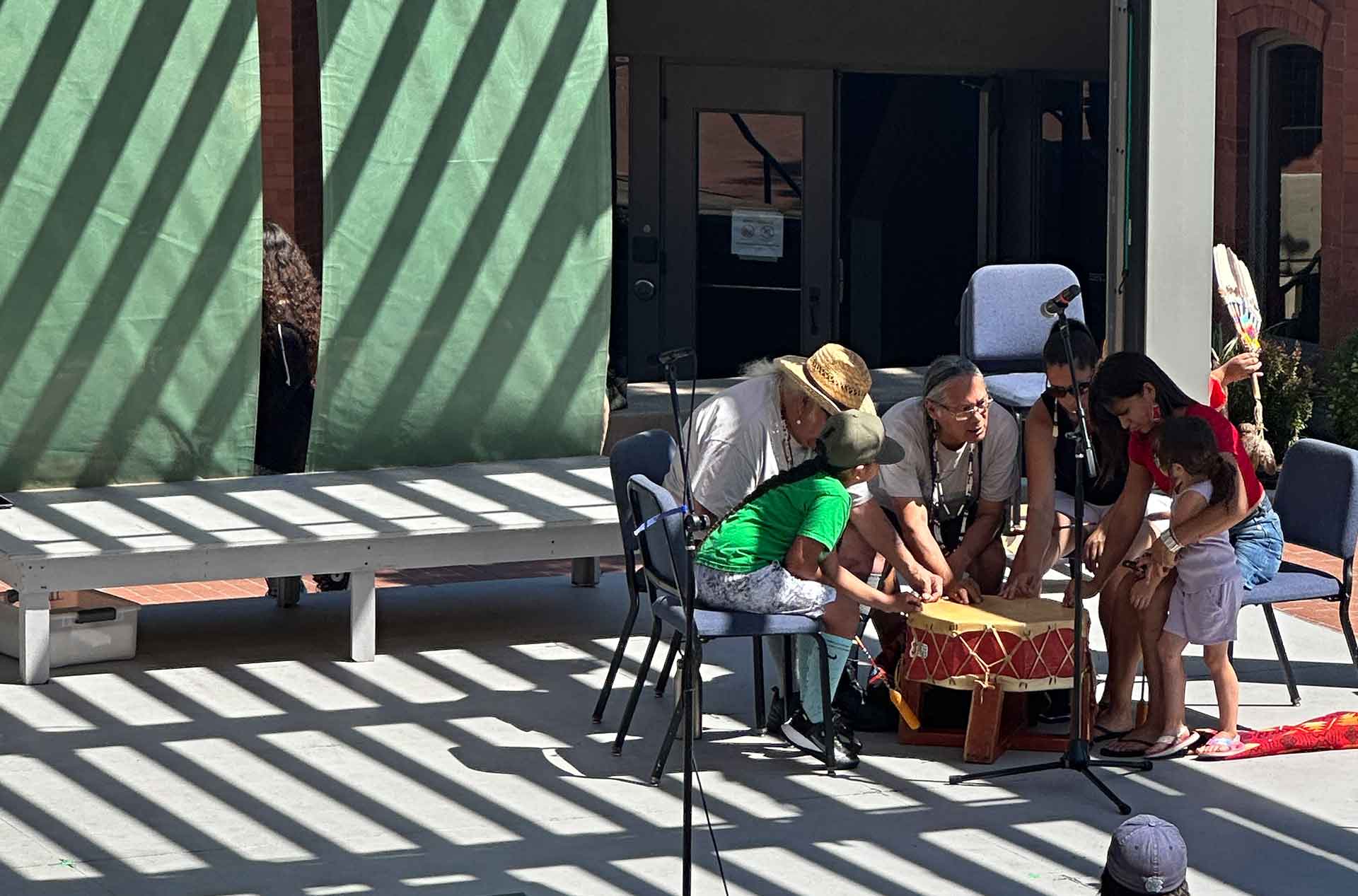 A group of people playing drums.