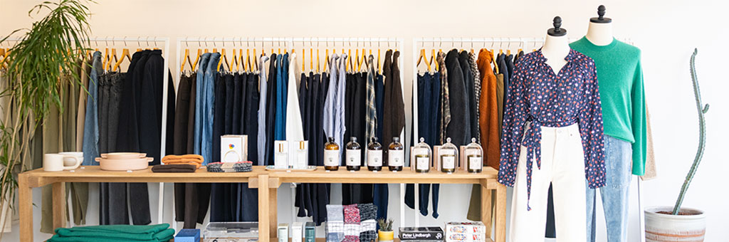 A rack of clothing hanging in a store.