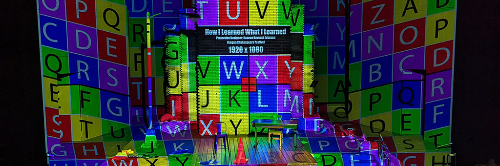 A colorful projection of letter tiles.