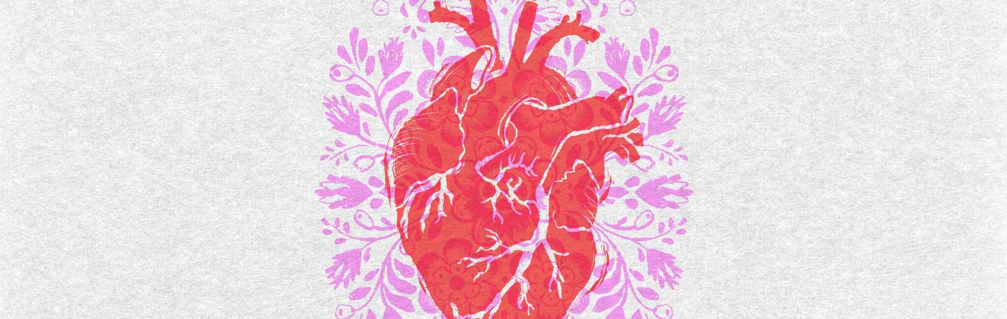Anatomical heart surrounded by decorative floral shapes in pink and red.