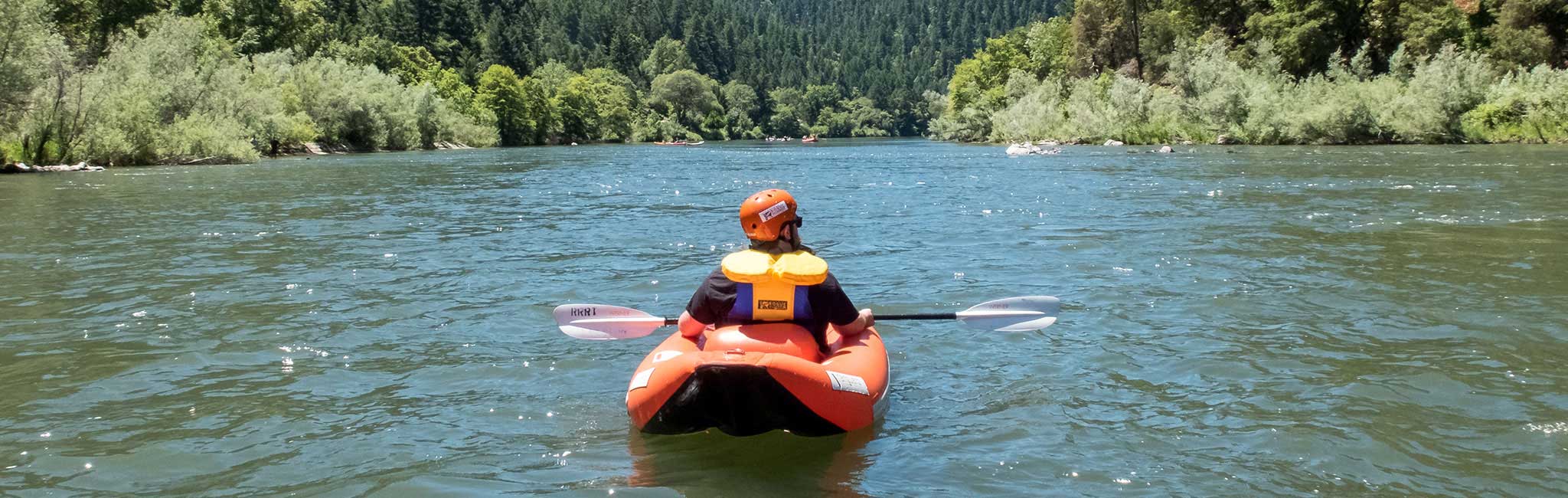 A person in a kayak on the Rogue River.