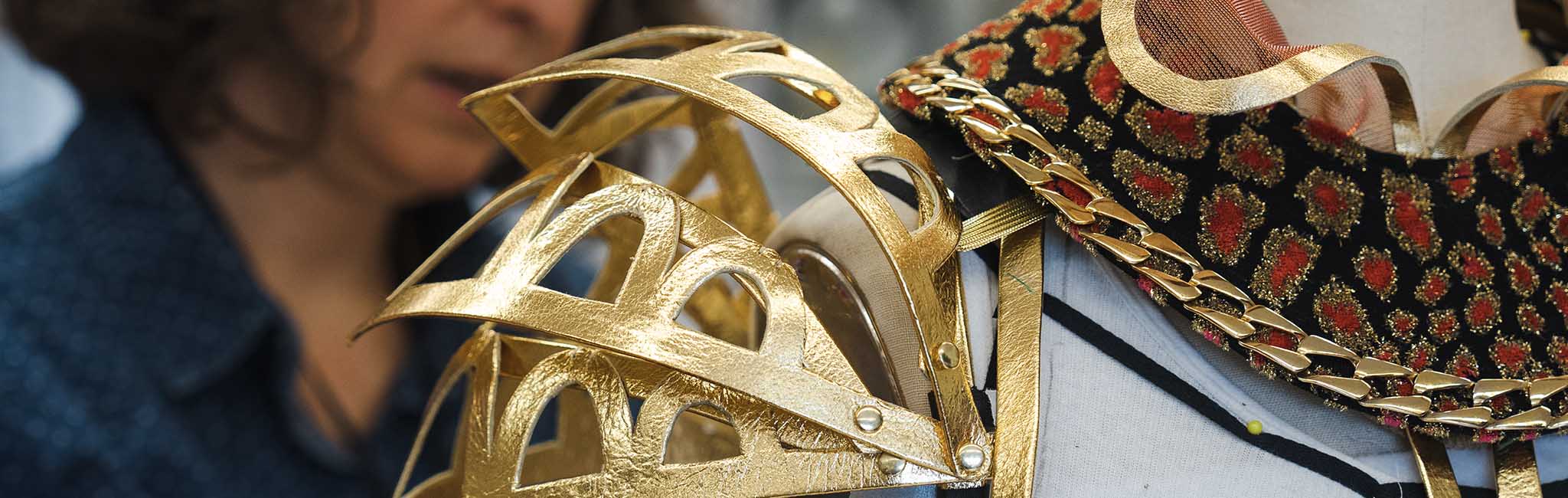 Close up of a gold shoulder costume piece.