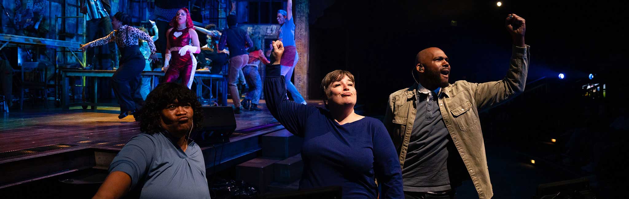 Three sign interpreters interpreting a show.