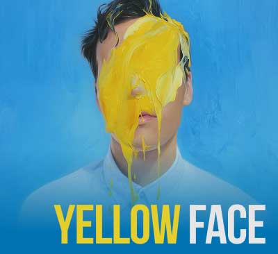 A person in a white shirt stands with their face obscured by a dramatic splash of yellow paint against a smooth blue background the title “Yellow Face” in text.