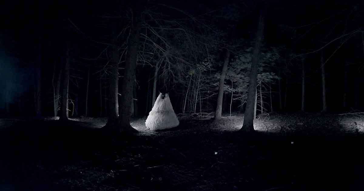 human in the forest at night